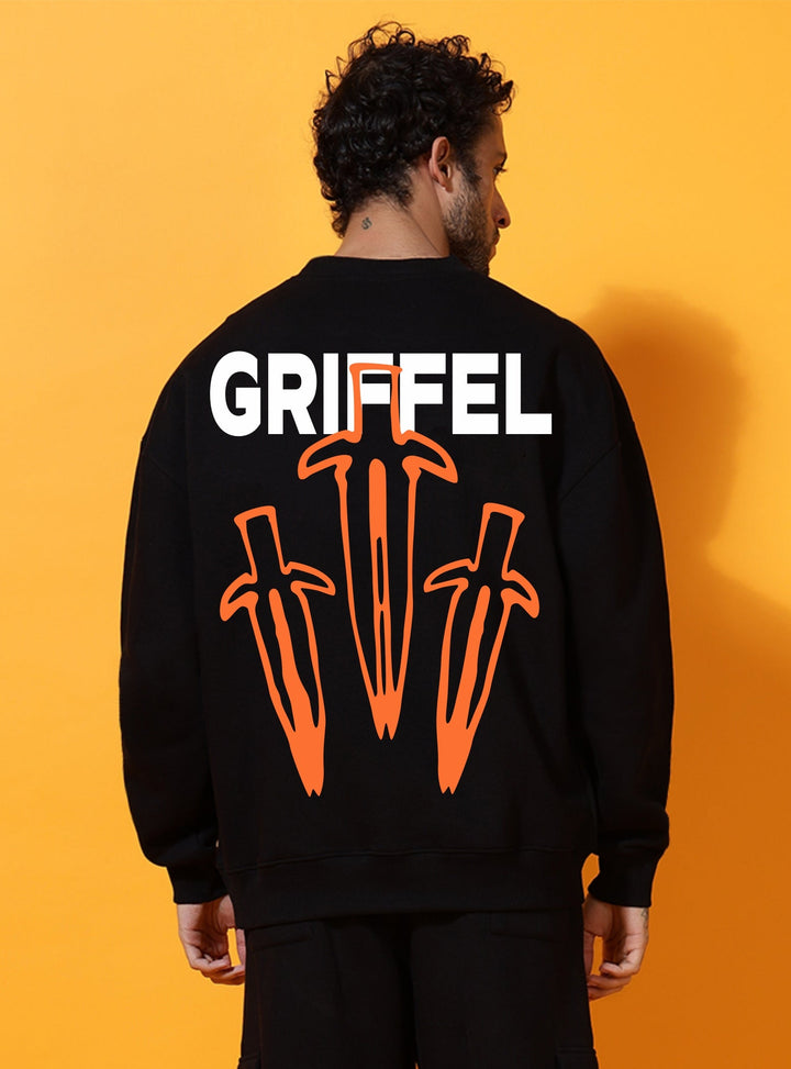 Person wearing a black outfit with 'GRIEFEL' branding on the back against an orange background